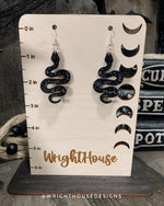 Load image into Gallery viewer, Celestial Snakes - Witchy Halloween Earrings - Engraved Glitter Black Acrylic Handmade Jewelry
