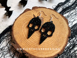 Load image into Gallery viewer, Gothic Style Bird Skulls - Witchy Halloween Earrings - Glitter Black Acrylic Handmade Jewelry
